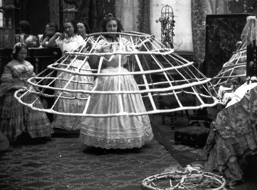 Mid-Victorian 1855 gown featuring massive crinoline skirt, elaborate ribbon trim, and detachable white undersleeves used in photo dating analysis - Family History Foundation