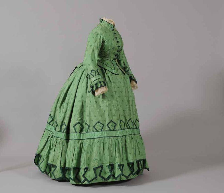 1850s day dress with steel cage crinoline creating dramatic bell-shaped skirt and wide pagoda sleeves for identifying vintage photograph dates - Family History Foundation