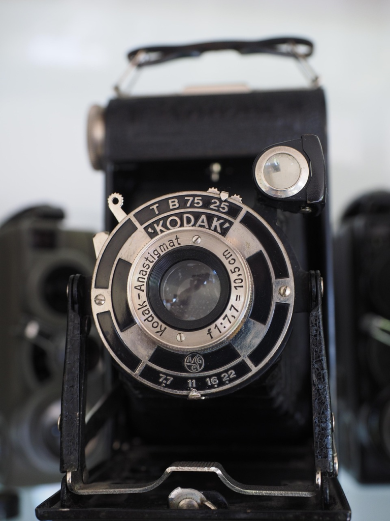 Original 1888 Kodak box camera with wooden construction and leather covering that revolutionized amateur photography with "You Press the Button" slogan - Family History Foundation