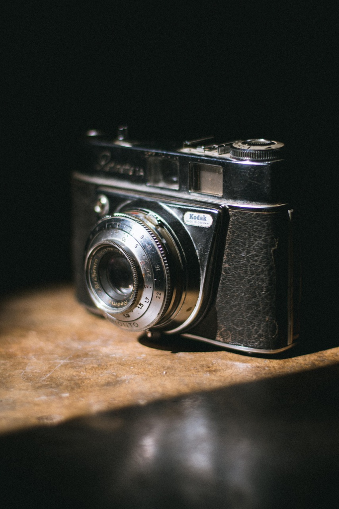 Original 1888 Kodak box camera with wooden construction and leather covering that revolutionized amateur photography with "You Press the Button" slogan - Family History Foundation